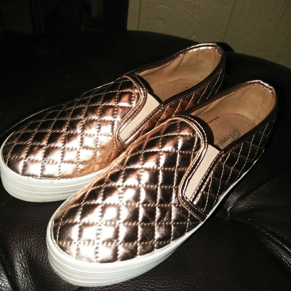 Gold sneaker type shoes lol
